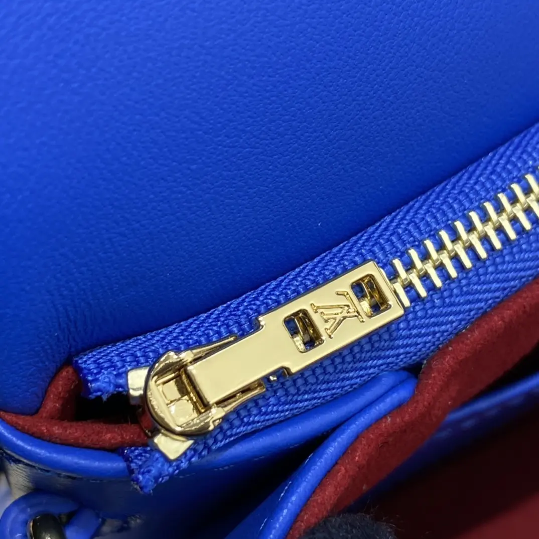 embossed lambskin pochette coussin blue red m80743 2