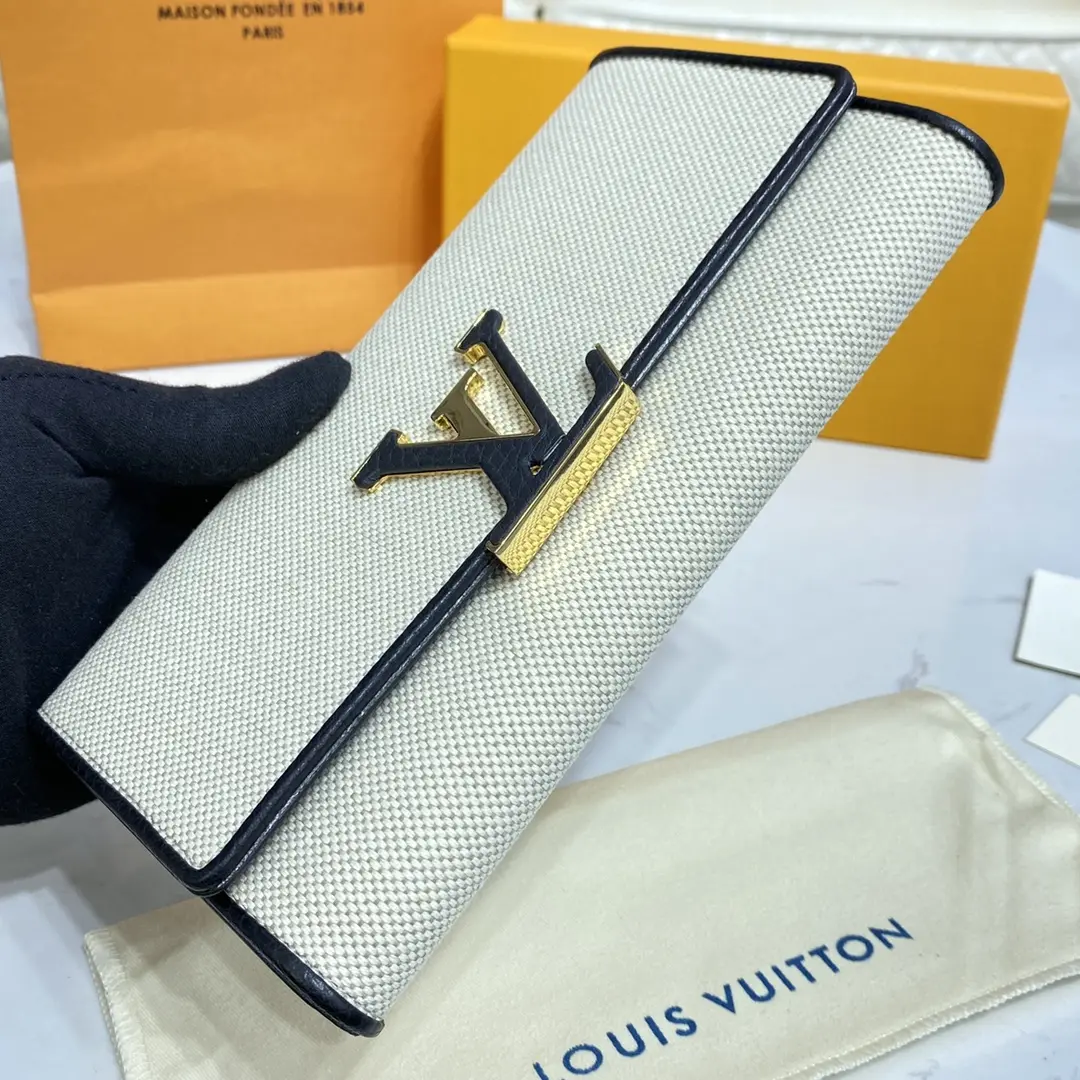 natural canvas capucines wallet m81305 4