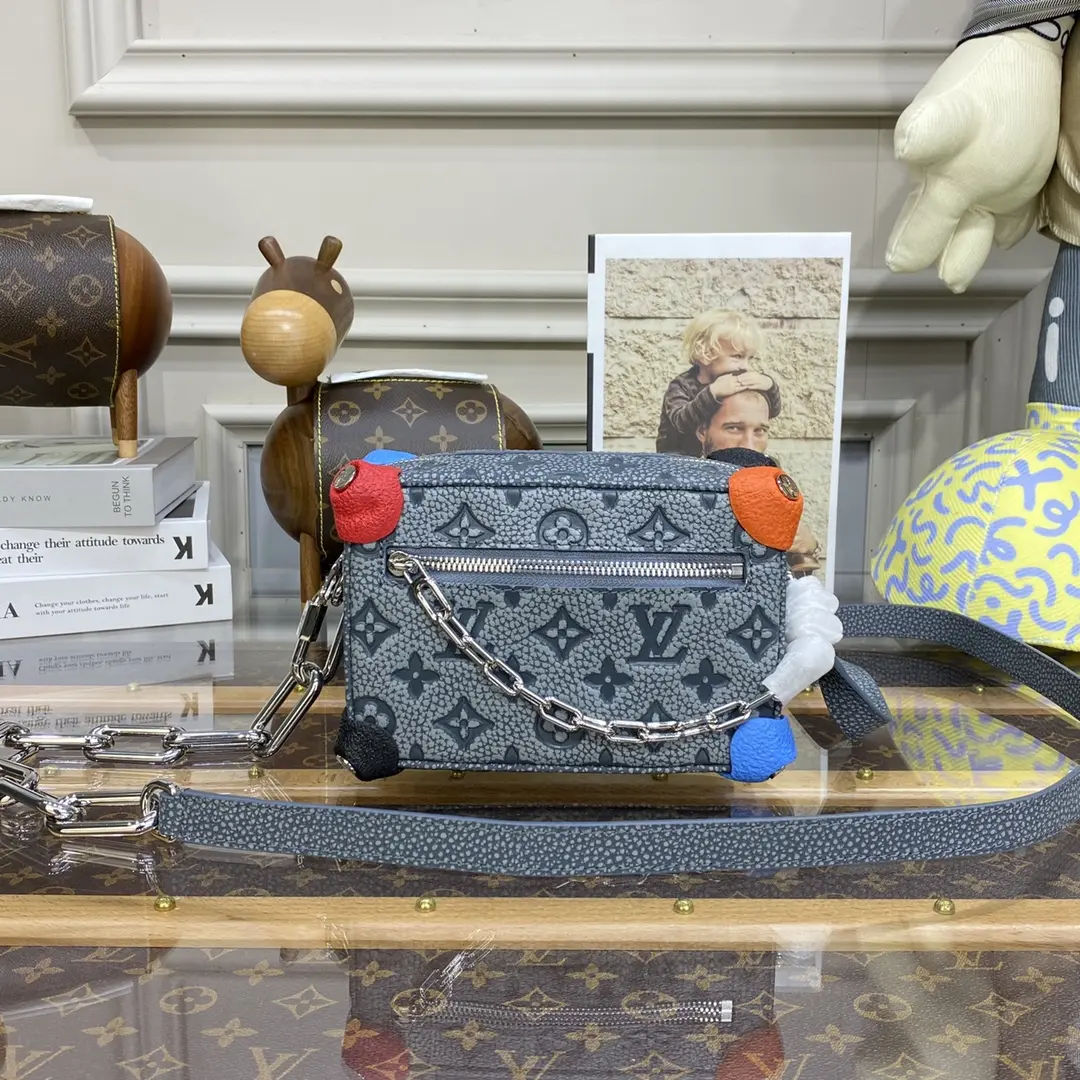 the houses emblematic monogram mini soft trunk bag gray m81606 gray 1 the houses emblematic monogram mini soft trunk bag gray m81606 gray 1